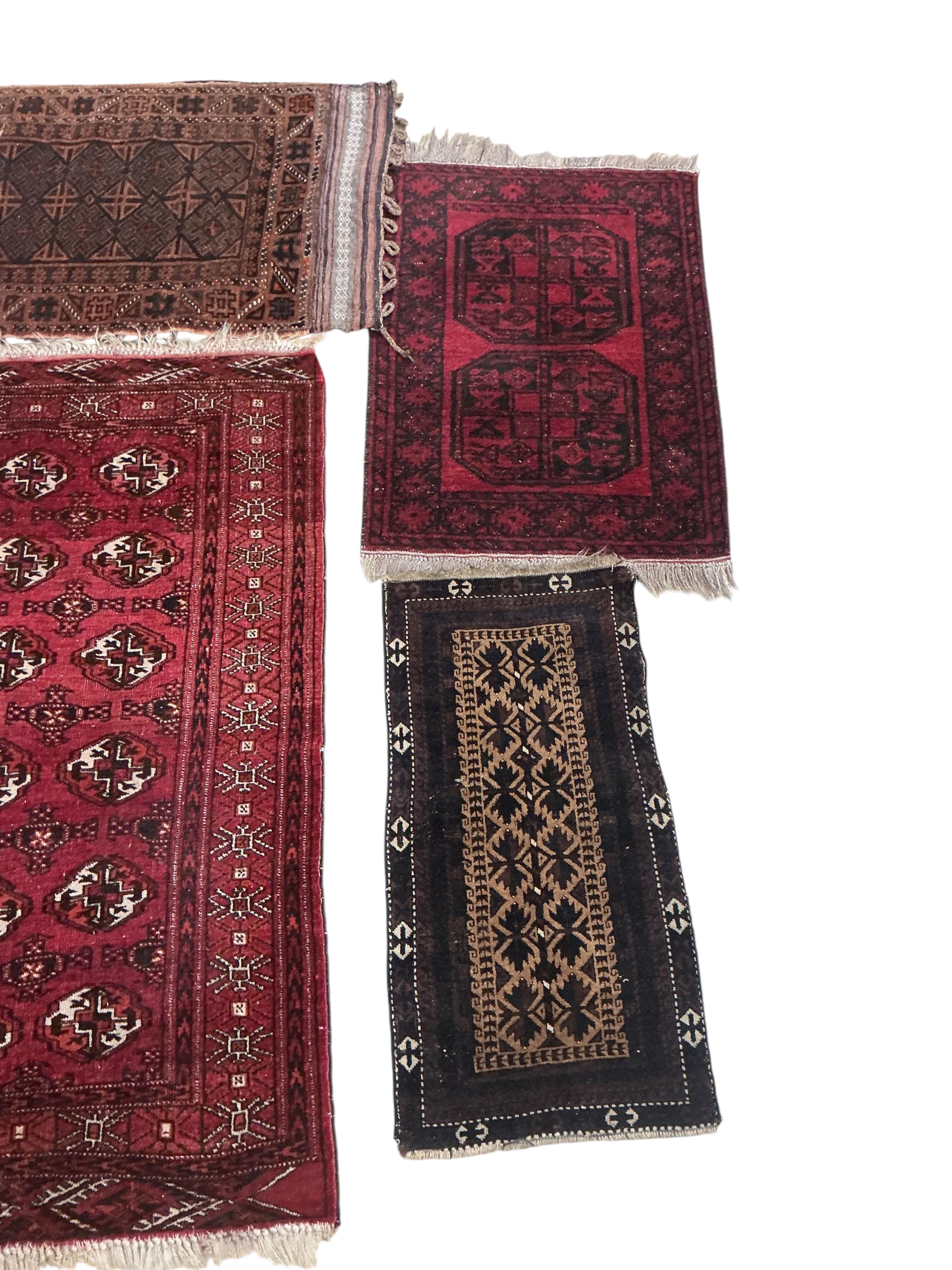 Four assorted Belouch and Afghan rugs, largest 150 x 100cm